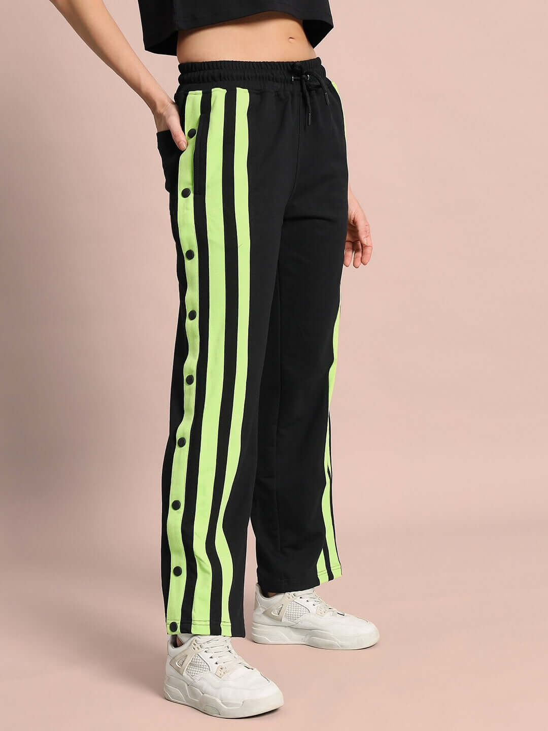 Women's Dancer Joggers in black with neon green stripes from DUDS, customizable fit available, side view of athletic wear.