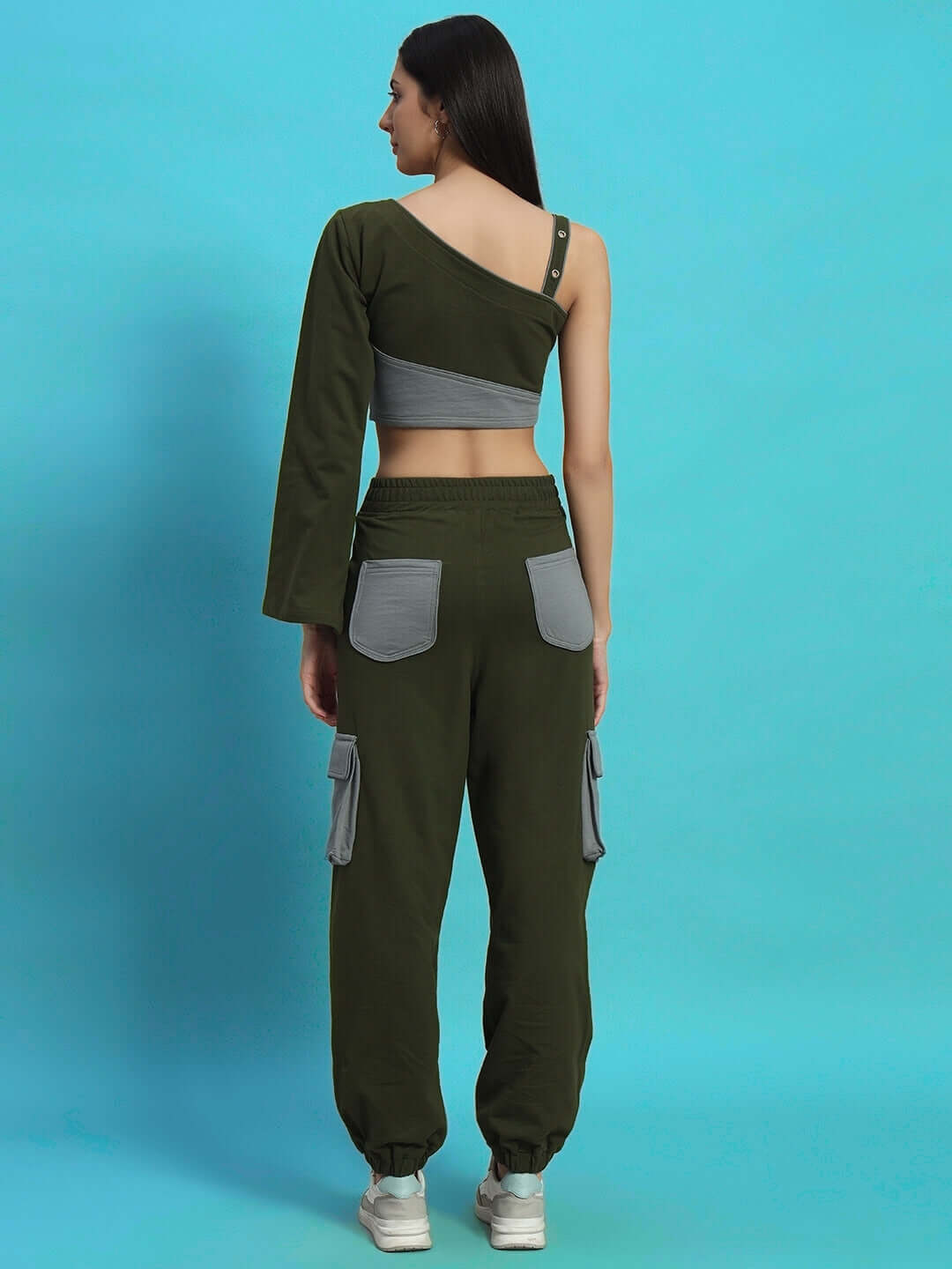 Back view of WOMEN'S DANIEL CO-ORD SET OLIVE GREY, showcasing one-shoulder top and cargo pants with a modern fit.
