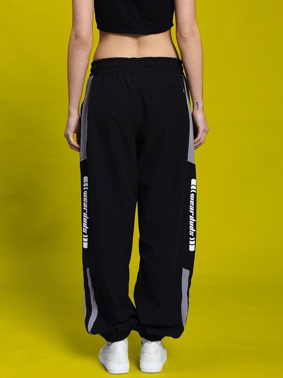 Back view of WOMEN'S DANNY RELAXED FIT CARGO PANTS BLACK showcasing comfort and street-smart style.