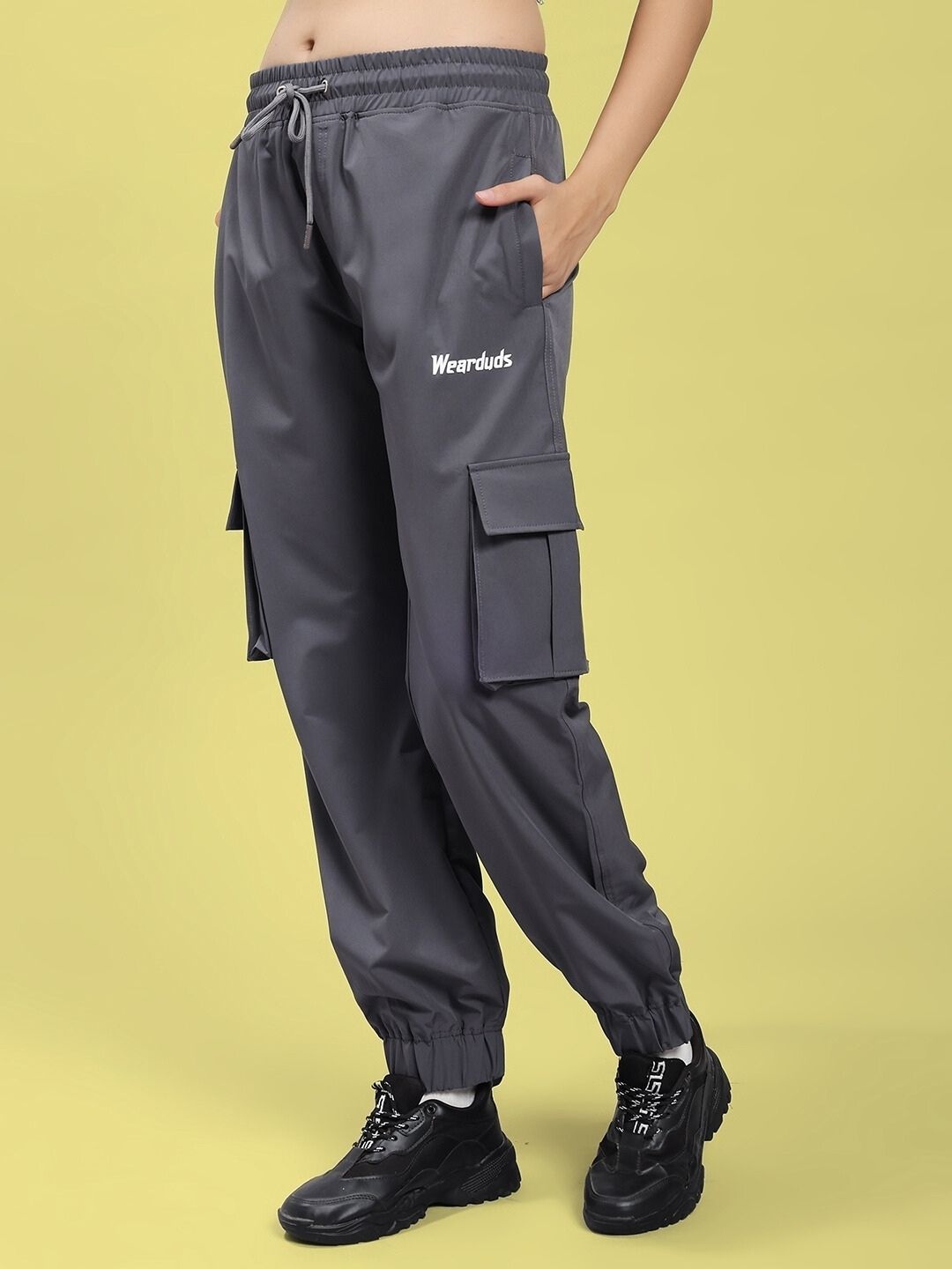 Woman wearing WOMEN'S JACK RELAXED FIT MULTI POCKET CARGO DARK GREY pants with utility style and comfort.