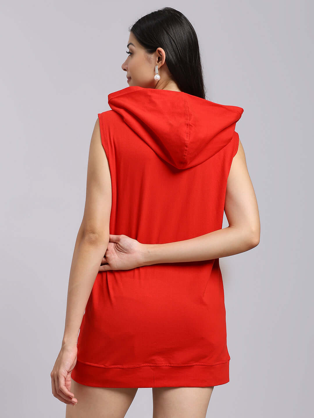 Woman wearing WOMENS DECENT GYM HOODED T-SHIRT RED, shown from the back, highlighting the hood and sleeveless design.