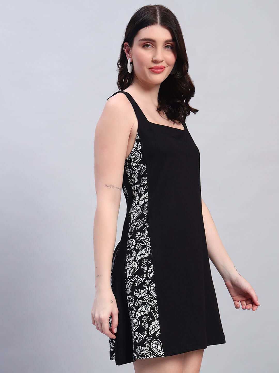 Women's Kudos Dress in black featuring a stylish paisley pattern, made from polyester and spandex, showcasing a chic and comfortable fit.