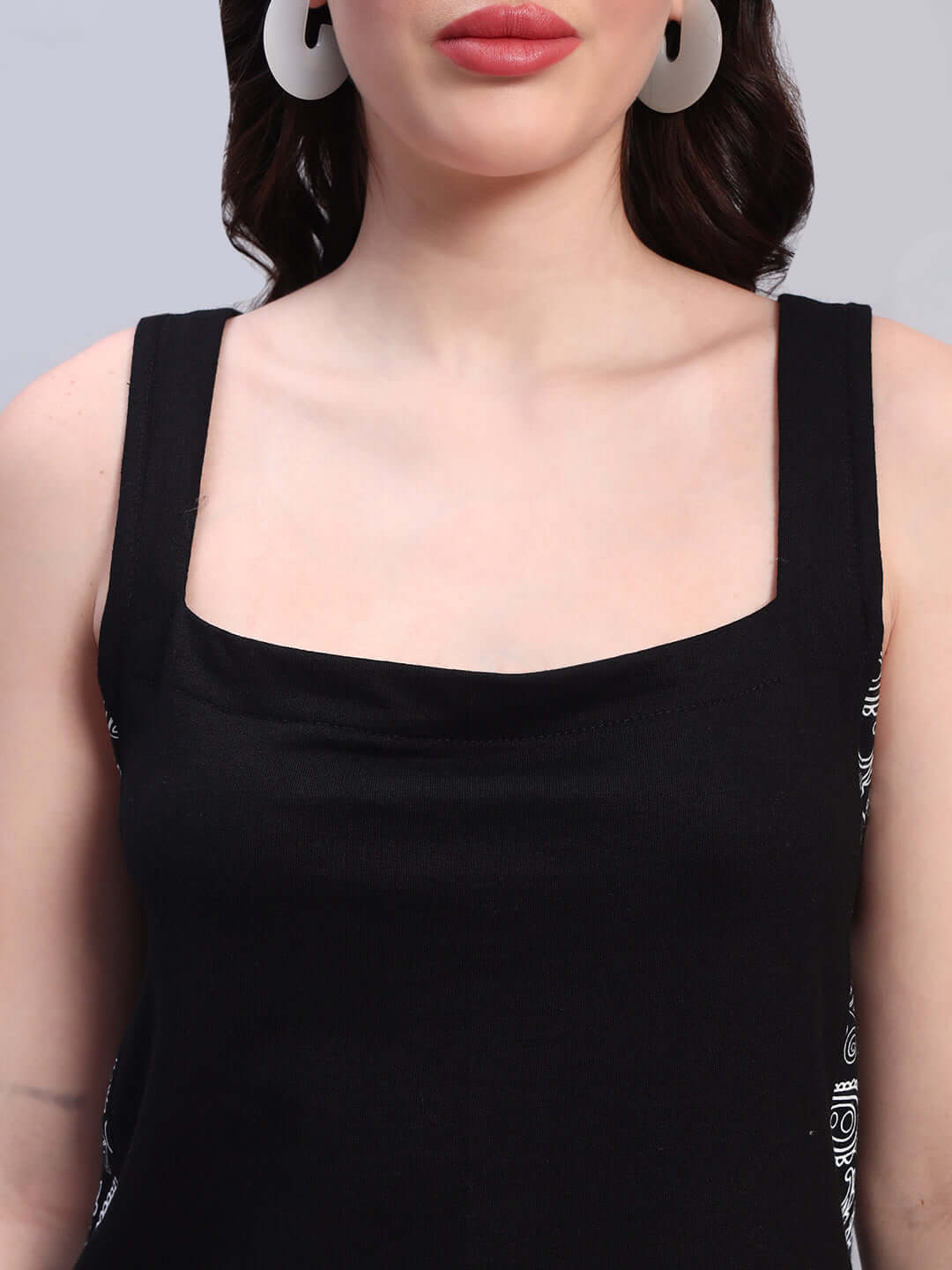 Close-up of women's black Kudos dress by Color By Colours, highlighting the neckline and fabric texture. Made in India.