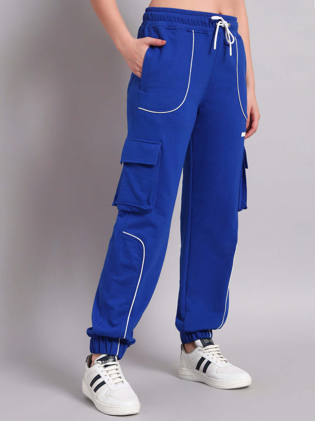 Women's Devano relaxed-fit joggers in blue with pockets, shown on a model, highlighting comfort and style.
