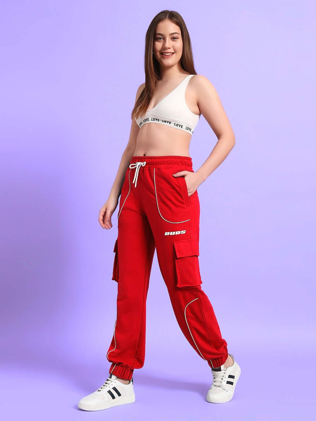 Woman wearing red relaxed-fit joggers with cargo pockets