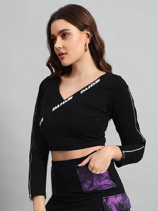 Woman wearing a black-purple tie-dye crop top, showcasing the stylish design and fit. Fashion crop top for women, casual wear.
