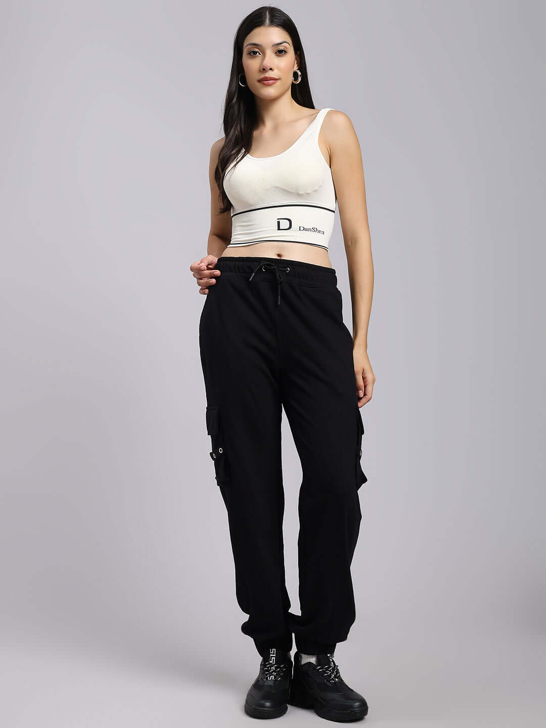 Woman wearing Women's DUDS Commando Joggers in black, showcasing comfortable fit and style for everyday use.