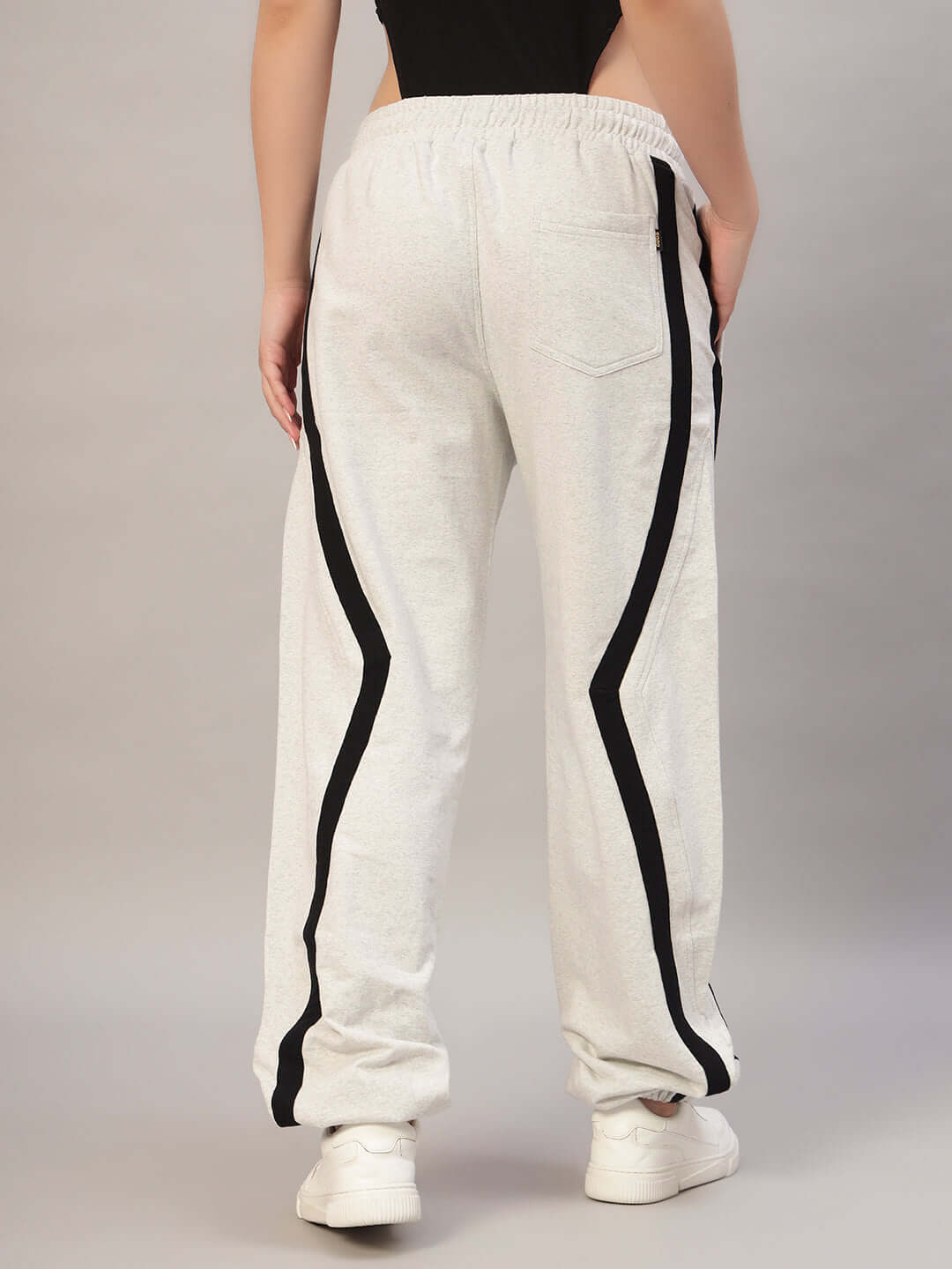 Back view of Women's DUDS Frame Joggers in melange grey featuring black side stripes, tailored for comfort and style.