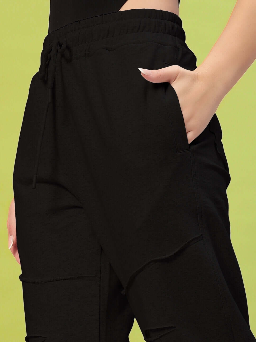 Black women's joggers by DUDS, featuring elastic waistband and side pockets, exemplifying custom fit options for comfort and style.