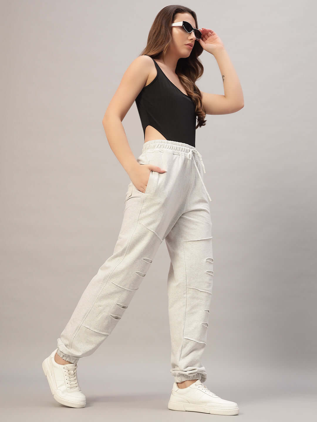 Women's DUDS Graze Joggers in melange grey, showcasing a stylish fit with pockets, perfect for casual wear.