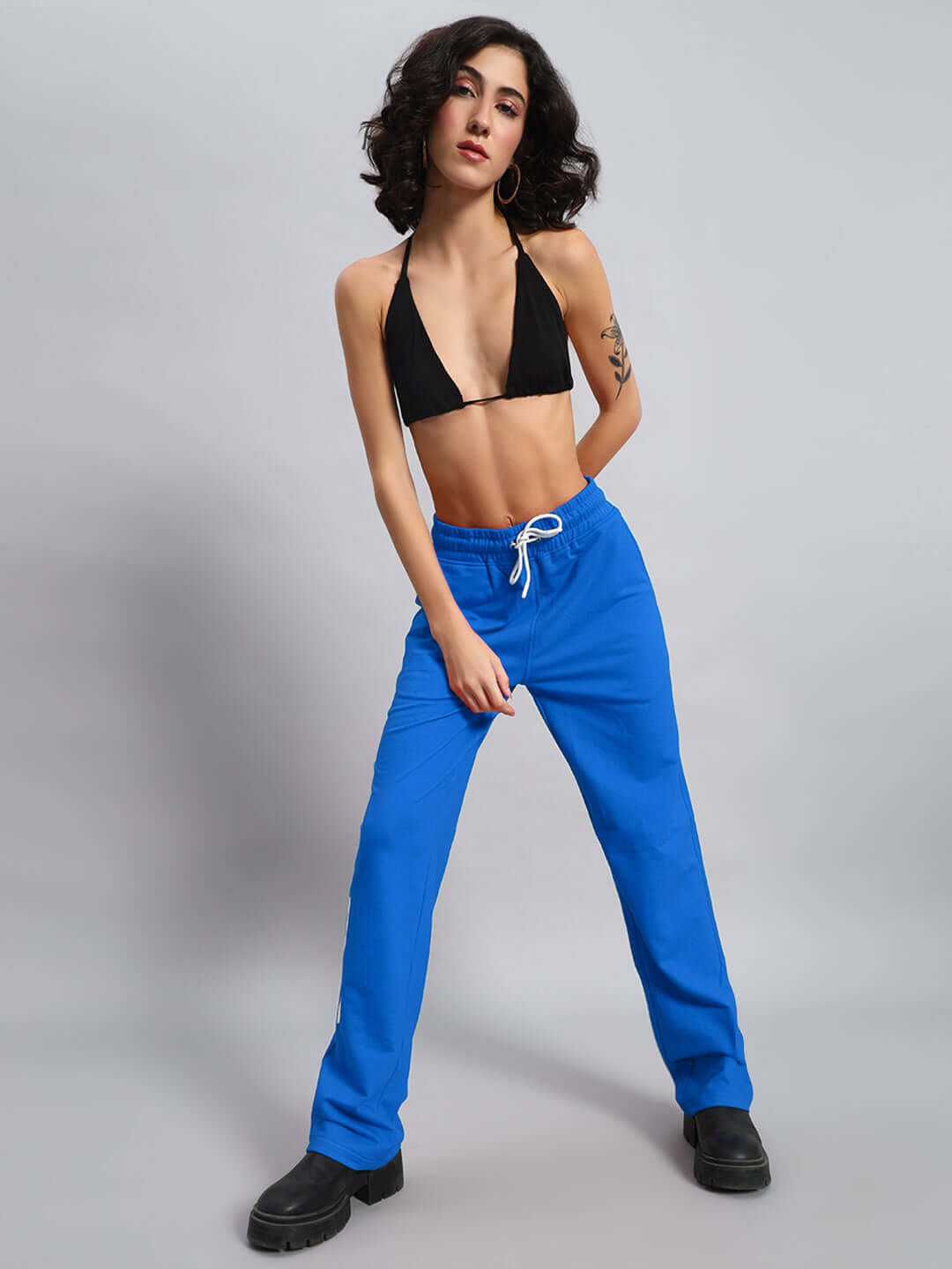 Model wearing Women's DUDS Limited Edition Jogger in blue, showcasing comfortable fit and vibrant color.