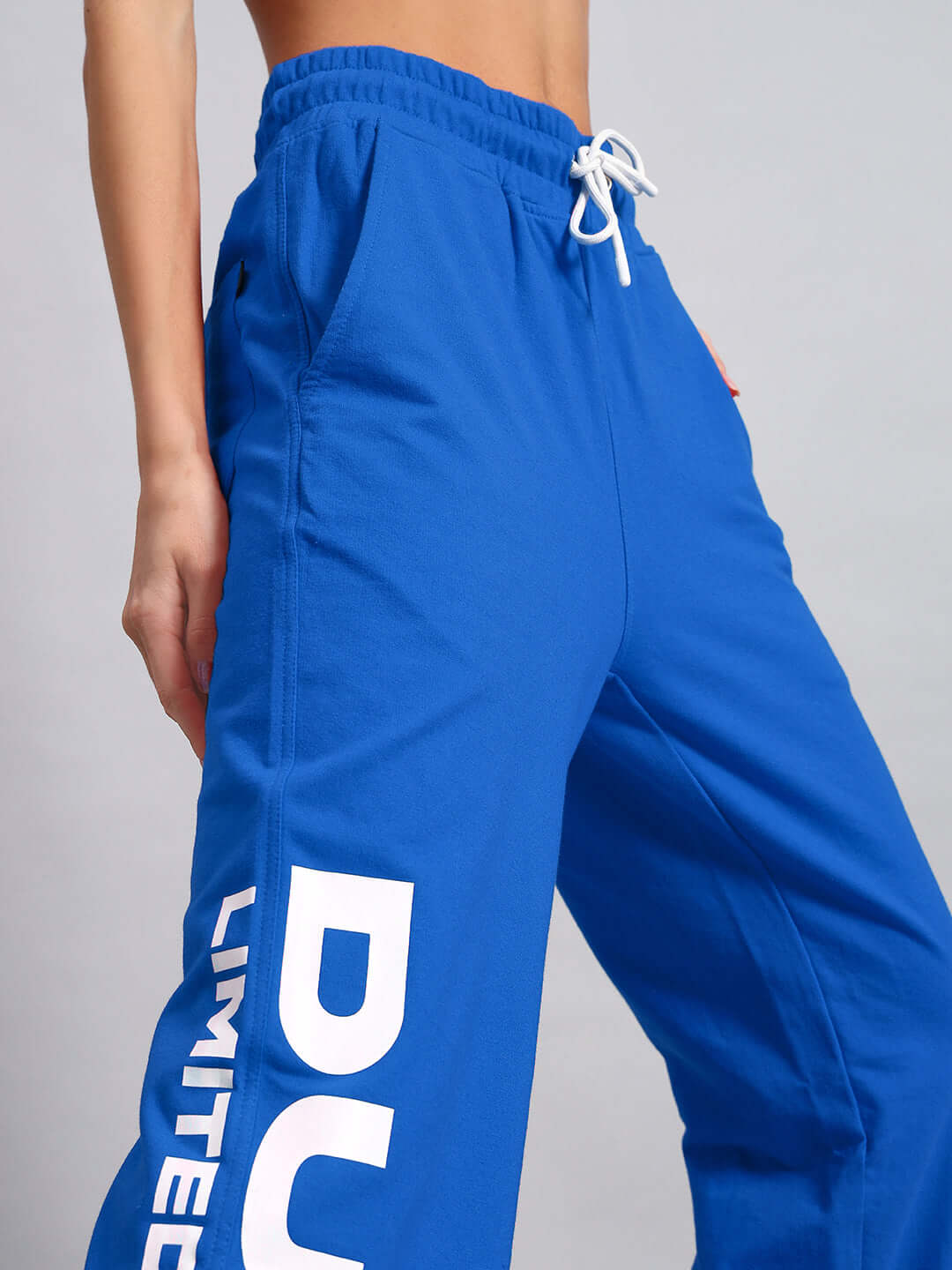 Women's blue joggers by DUDS, limited edition, featuring custom fit option by experienced tailors. Made to order.