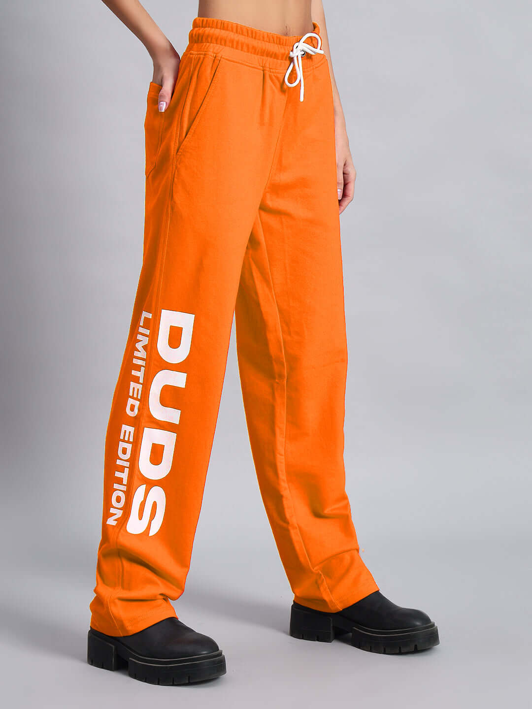 WOMEN'S DUDS LIMITED EDITION JOGGER ORANGE with white lettering on side, displayed against a neutral background.