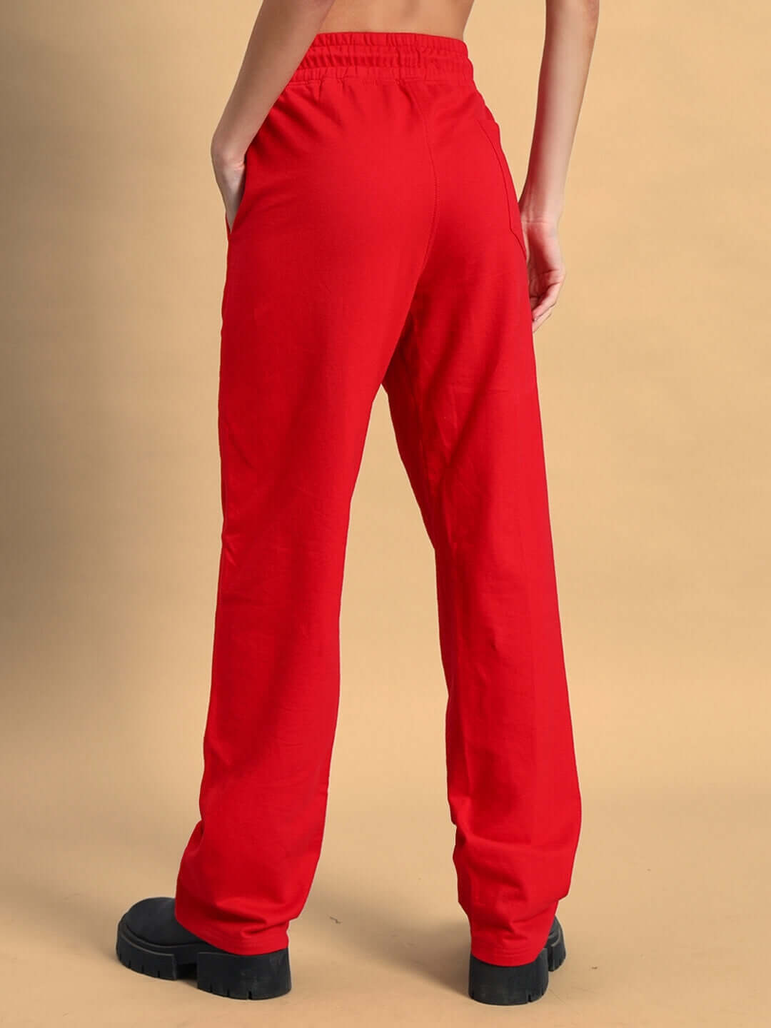 Back view of women's red limited edition jogger pants by DUDS, showcasing comfortable fit and style for casual wear.
