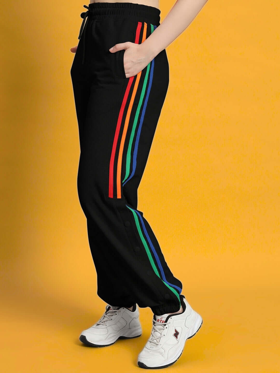 Stylish women's black joggers with colorful stripes, featuring comfortable fit and made by DUDS. Ideal for a vibrant and casual look.