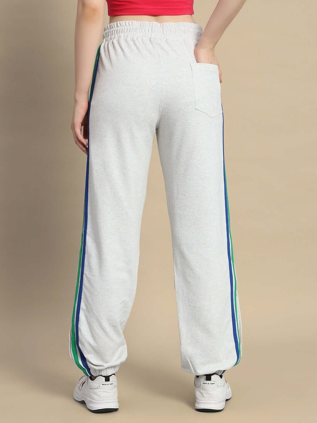 Back view of Women's DUDS Prism Colorful Stripe Joggers in Melange Grey, showcasing vibrant side stripes and elastic waistband.