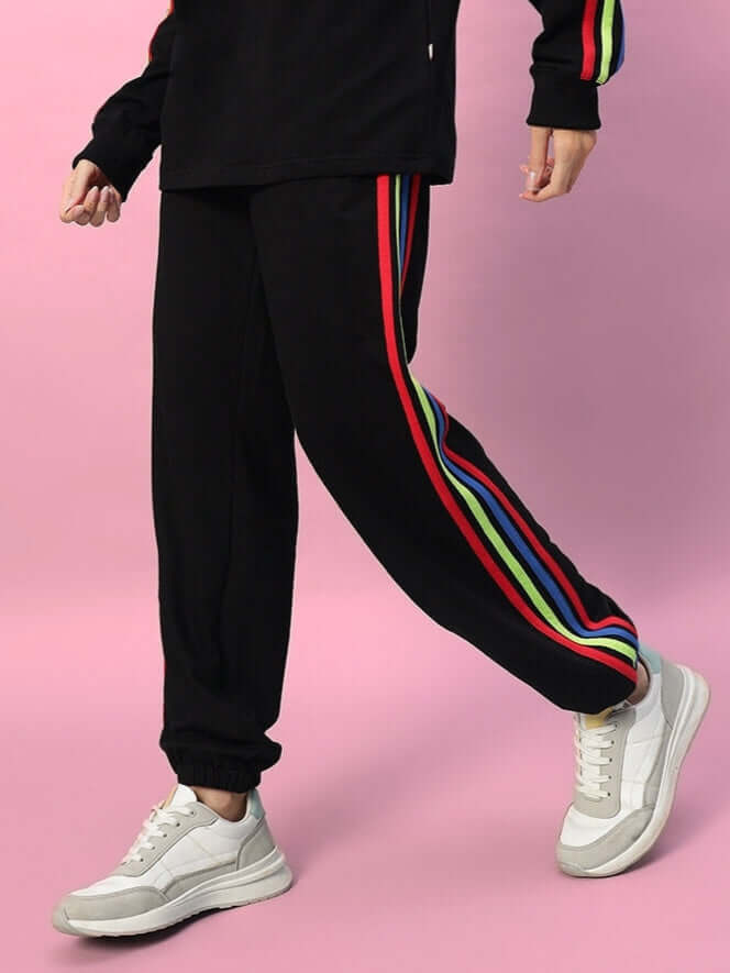 Women's DUDS rainbow colorful stripe joggers in black, featuring vibrant side stripes, designed for custom fit and comfort.
