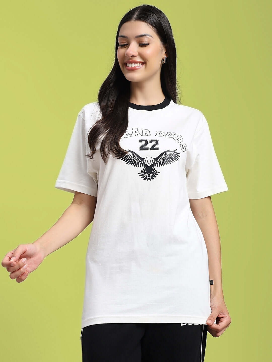 Woman wearing a white cotton T-shirt with eagle wings graphic, regular fit. Made in India, premium fabric, eco-friendly bio-wash.