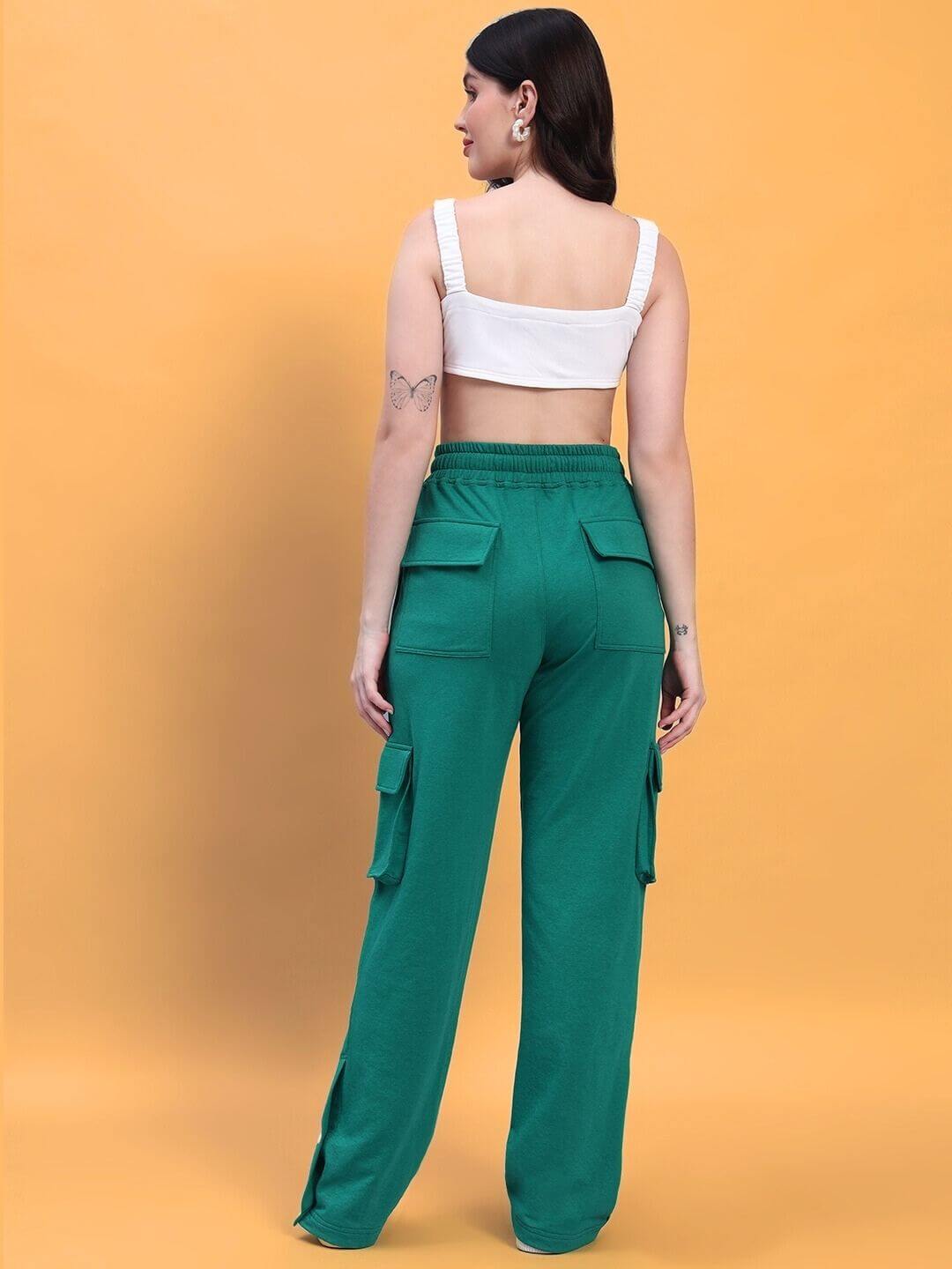 Back view of model wearing WOMEN'S EASTON CO-ORD SET WHITE-GREEN, featuring white top and green pants in a stylish setting.