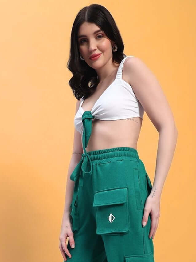 Model wearing WOMEN'S EASTON CROP-TOP in white, made of premium heavy gauge cotton, paired with green cargo pants, styled for casual look.
