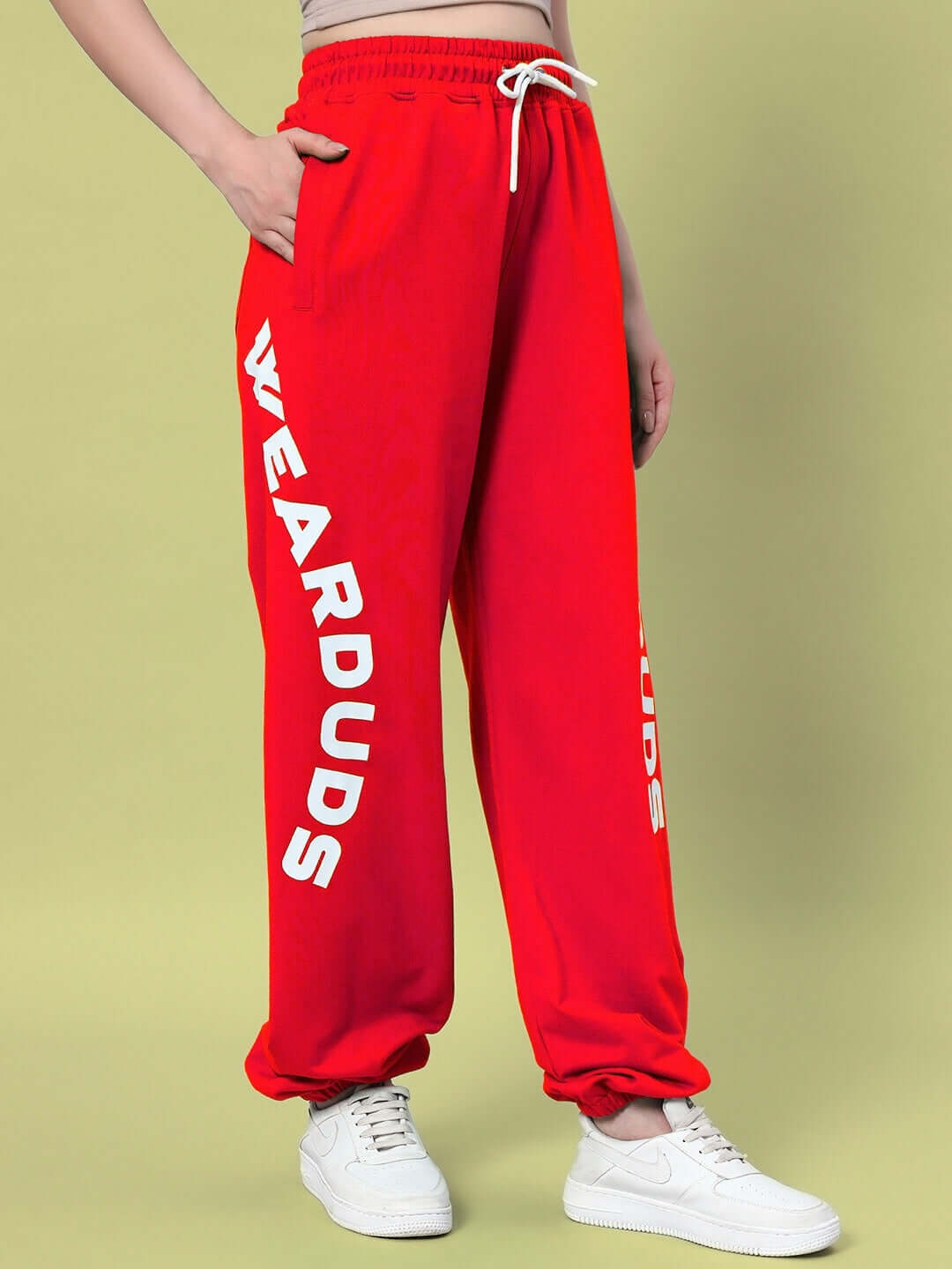 Women's red Ellen relaxed fit jogger pants by DUDS, featuring side pockets and elastic waistband, ideal for custom fit options.