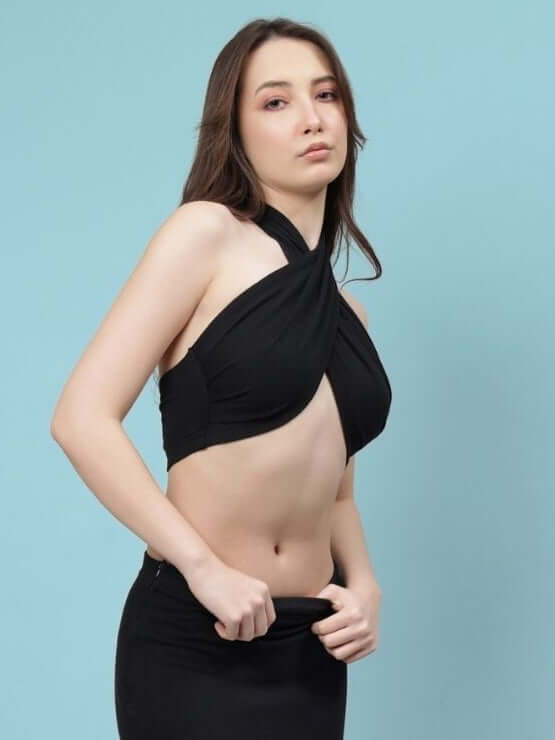 Model wearing Women's Erza Warp Crop-Top in black, crafted from premium heavy gauge 100% cotton, showcasing stylish halter neck design.