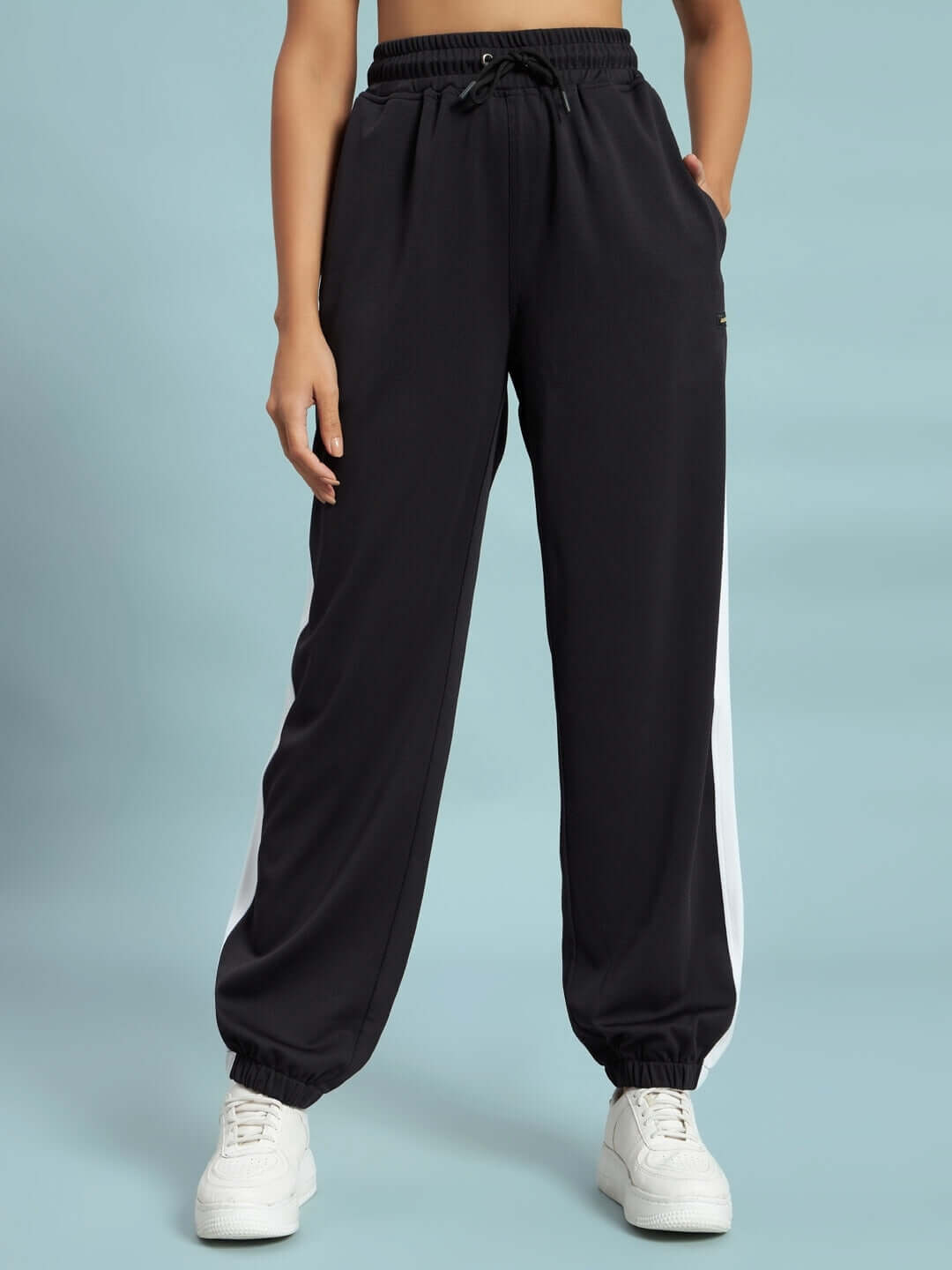 Women's Euphoria Joggers in black and white, made-to-order by DUDS Tailors, offering custom fit sizing and premium style.