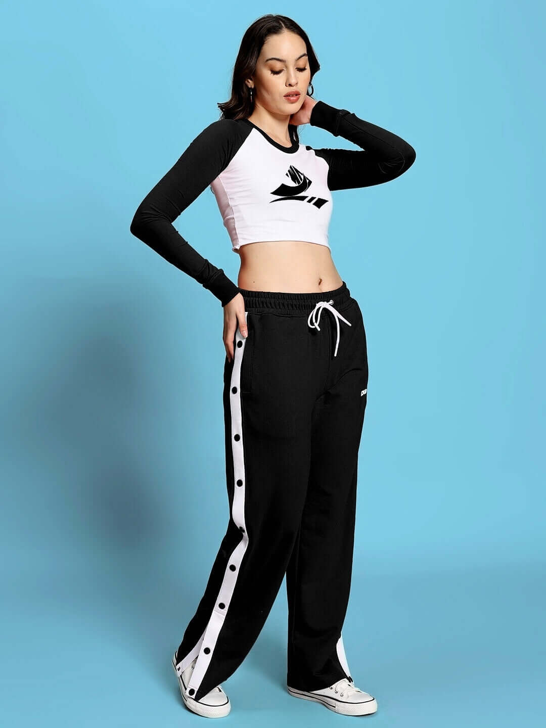 Model wearing Women's Ezel Co-Ord Set in black-white with relaxed fit joggers and elastic waistband, made from 97% cotton, front view.