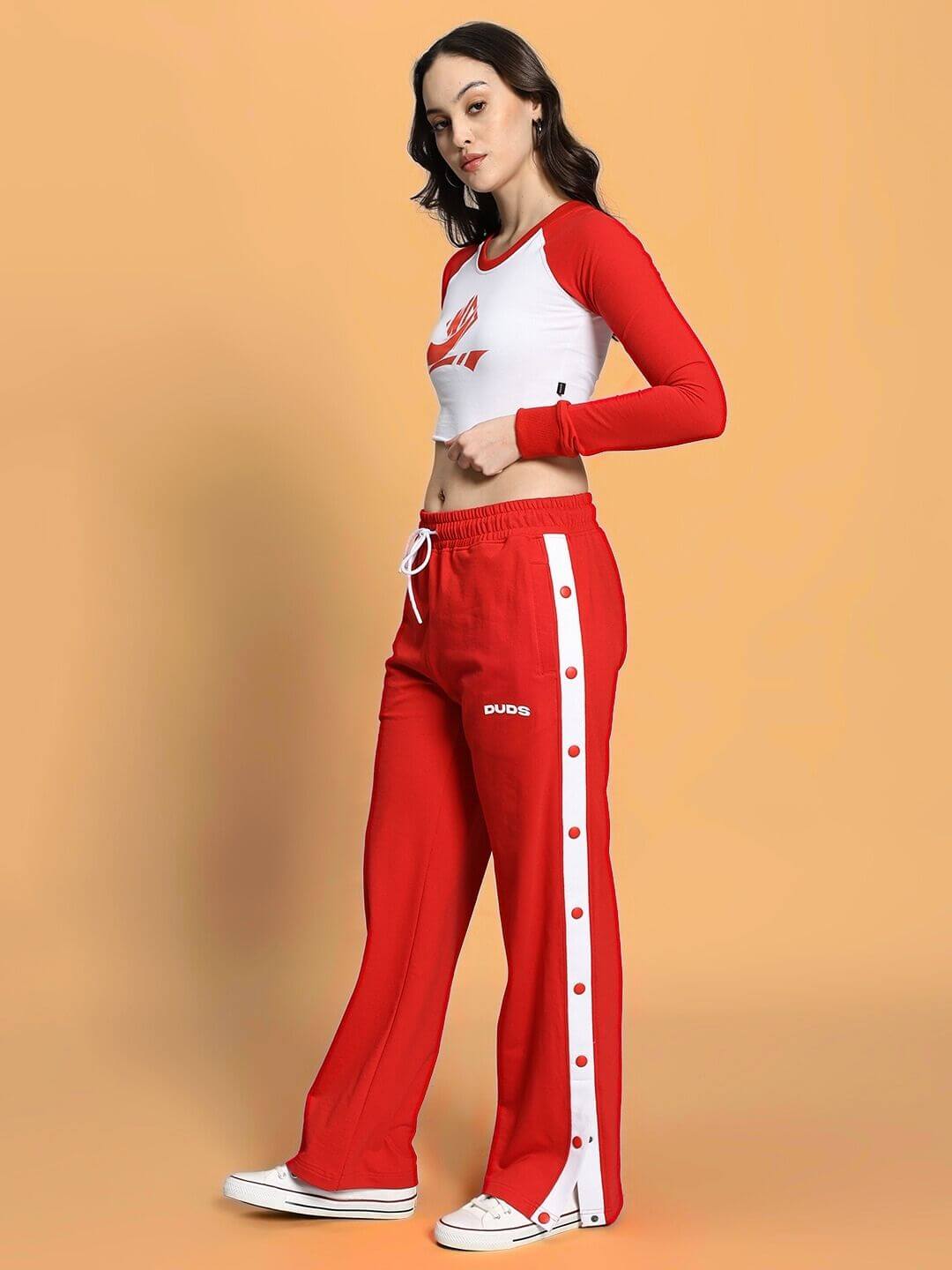 Woman wearing WOMEN'S EZEL CO-ORD SET RED-WHITE with sporty design and street-chic style.