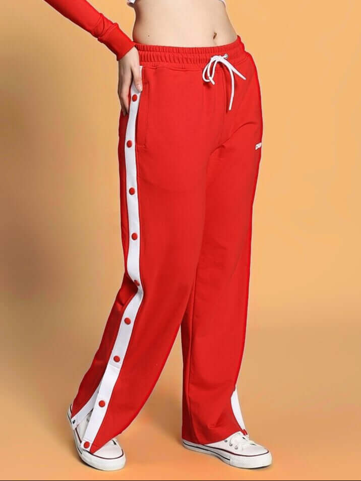Women's red Ezel relaxed fit jogger with buttoned side stripe, comfortable fashion wear by DUDS, custom fit available.