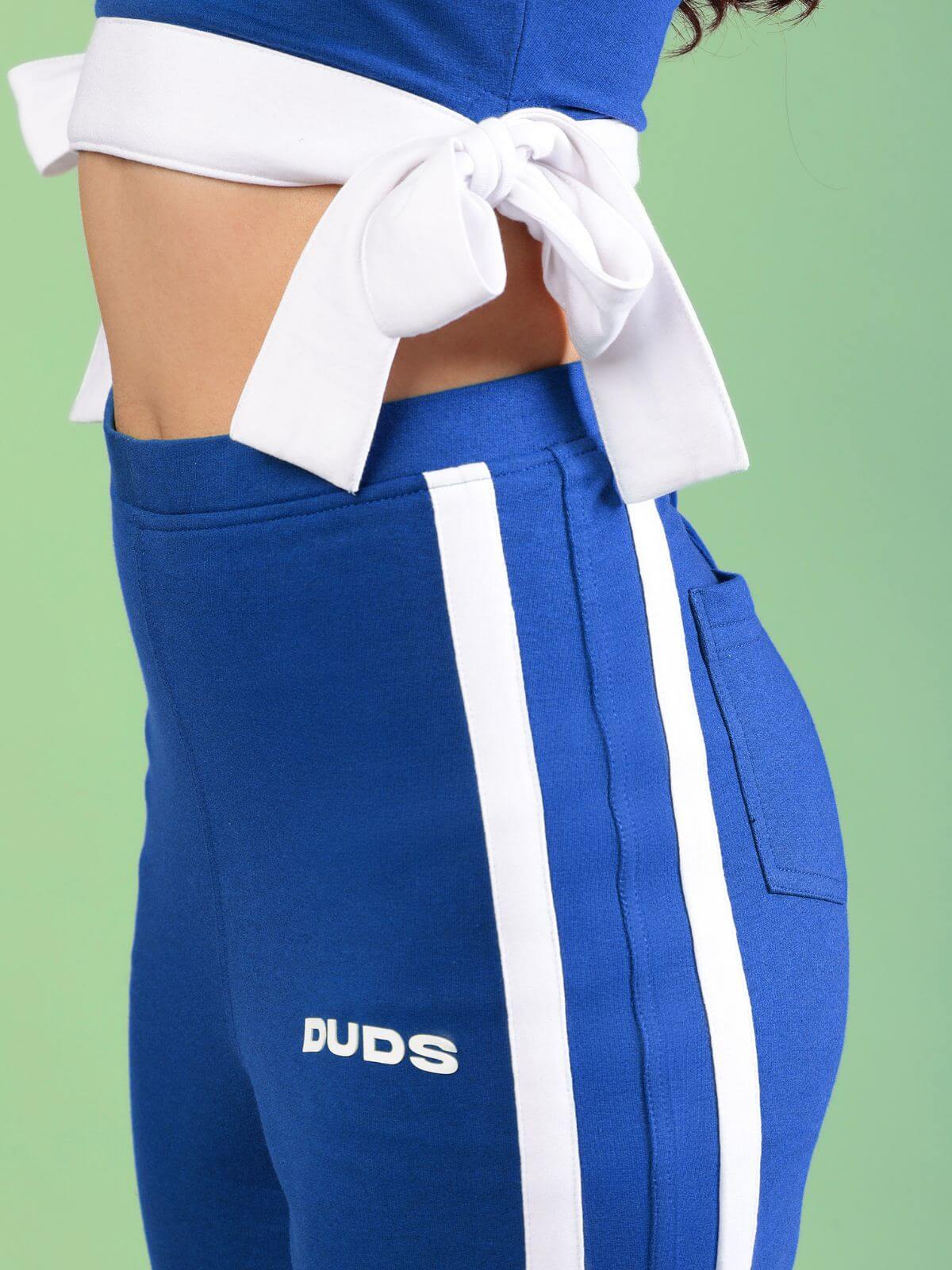 WOMENS FITTONIA COOL CO-ORD SET BLUE featuring a stylish cropped top and matching sporty pants with side stripes.