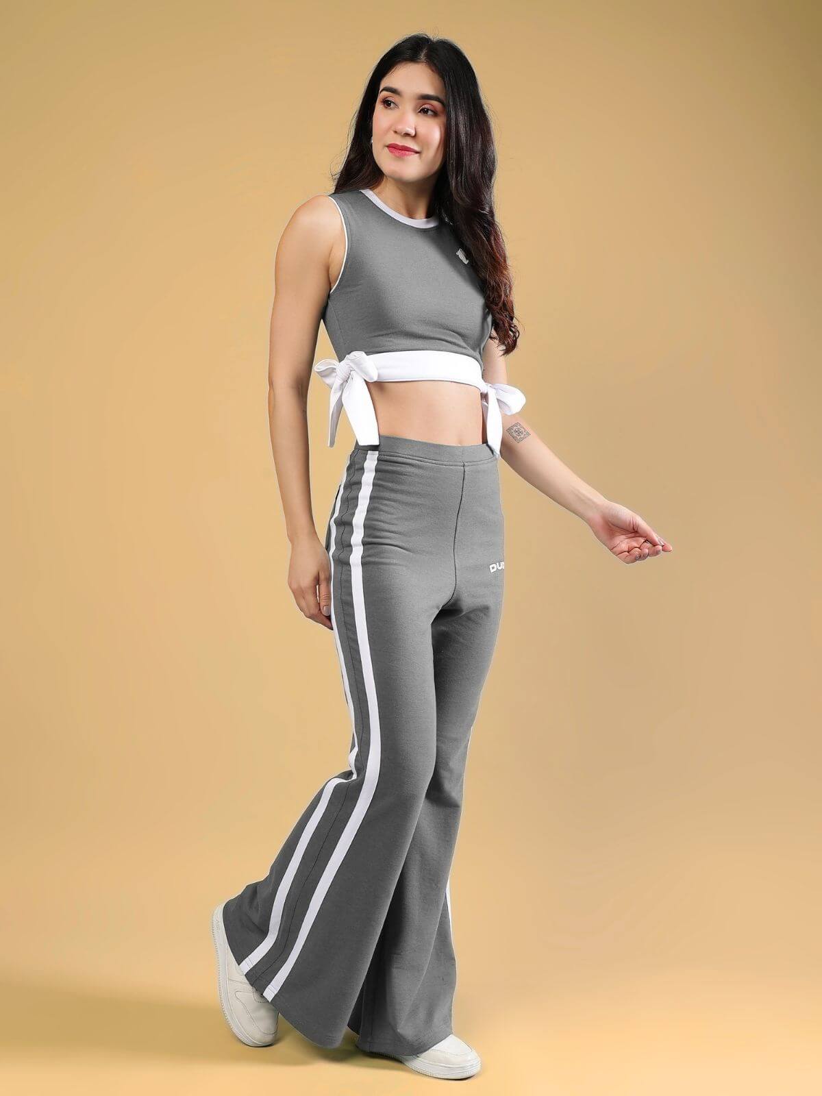 WOMENS FITTONIA COOL CO-ORD SET GREY worn by model against a warm background, showcasing trendy style and comfort.