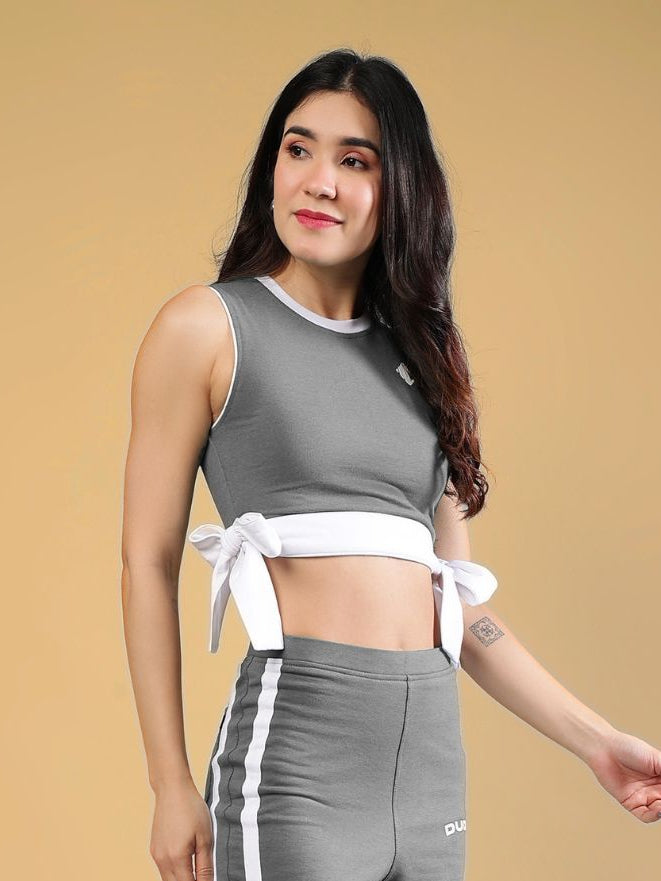 WOMENS FITTONIA COOL CROP TOP GREY styled with matching grey bottoms, featuring a modern bow tie detail and casual look.