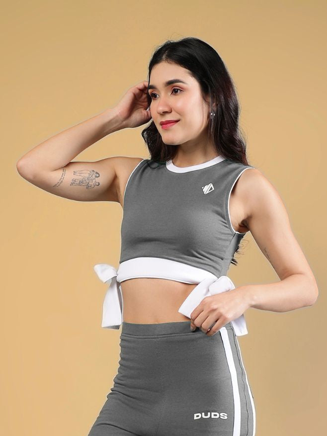 WOMENS FITTONIA COOL CROP TOP GREY worn by a model, showcasing the stylish cropped design and bow tie detail.