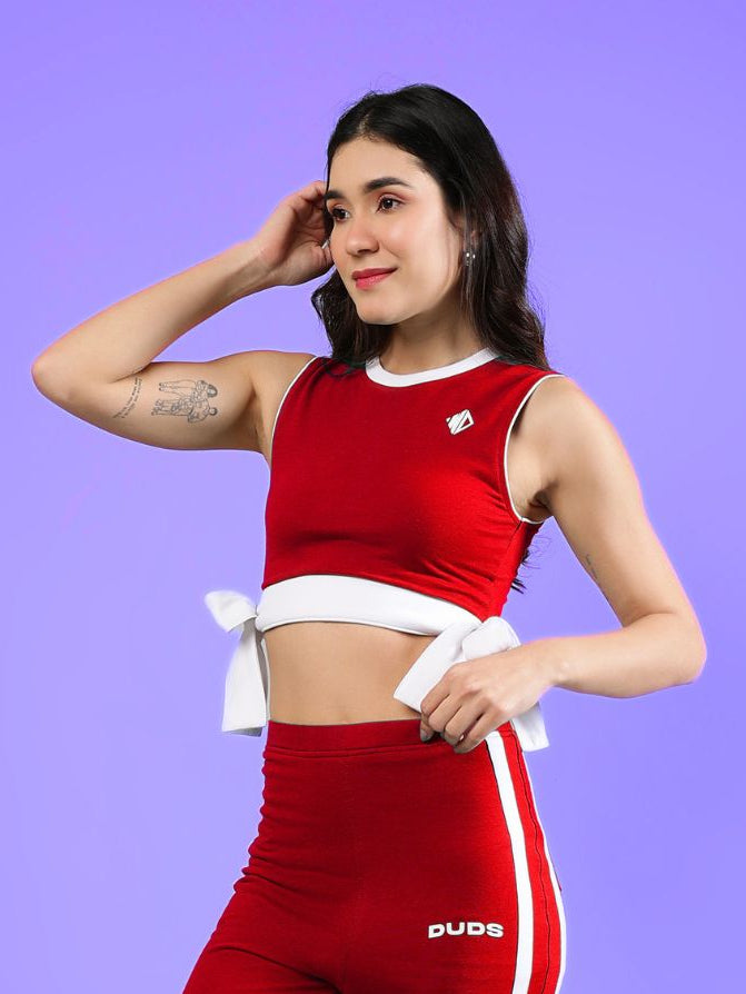 WOMENS FITTONIA COOL CROP TOP RED worn by model with a stylish pose against a colorful background.