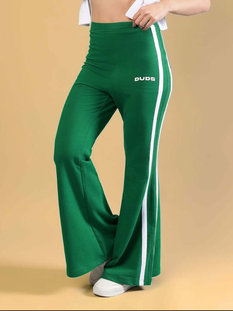 WOMENS FITTONIA COOL WIDE FLARE JOGGERS GREEN featuring a stylish wide-flare silhouette in a vibrant green color.