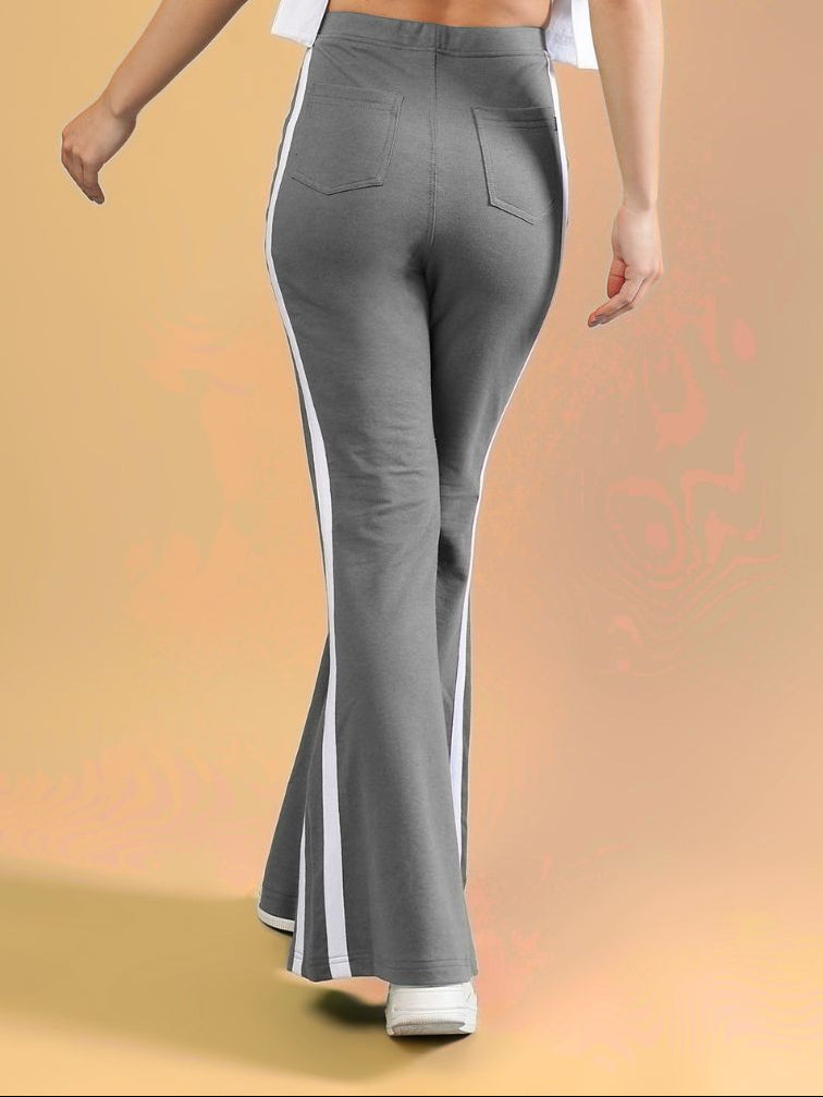 WOMENS FITTONIA COOL WIDE FLARE JOGGERS GERY in grey with white stripes, showcasing a stylish and relaxed fit.