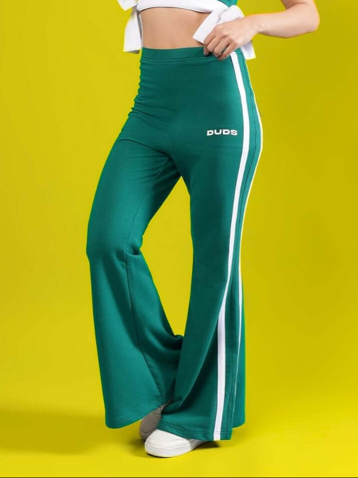 Teal green women's wide flare joggers by DUDS with white side stripes.