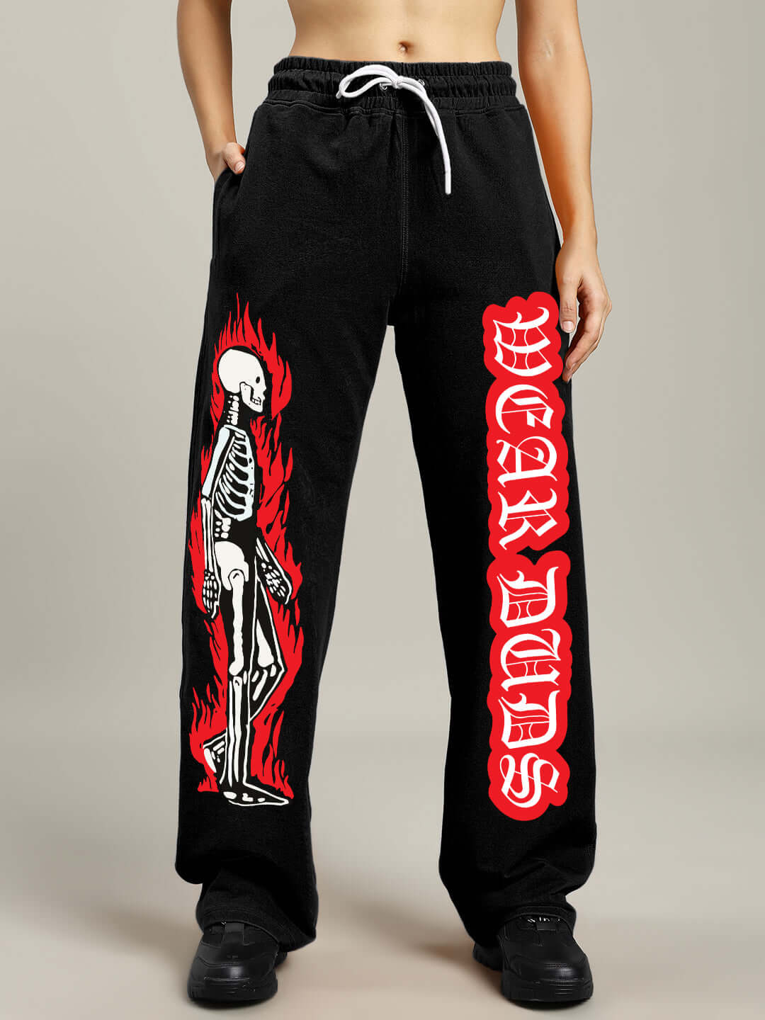 Black women's jogger with flaming skeleton print by DUDS, featuring a relaxed fit and custom size options. Perfect for casual style.