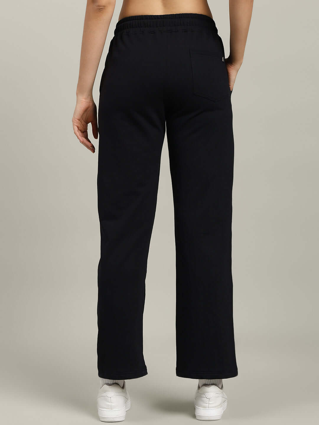 Back view of WOMEN'S FLICKER OVERSIZED CO-ORD SET BLACK with relaxed fit joggers and elasticated waistband.