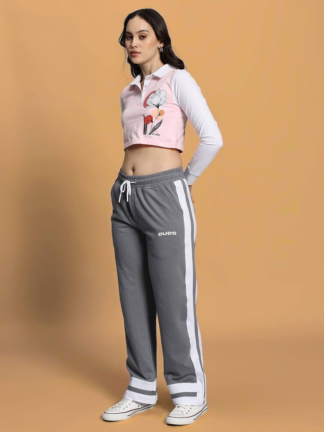 Model wearing WOMEN'S FLORA CO-ORD SET PINK GREY by WEAR DUDS, showcasing stylish and comfortable streetwear for women.