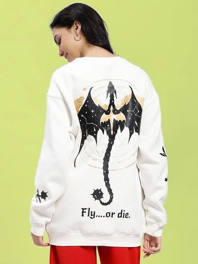 Model wearing WOMEN'S FLY OR DIE DRAGON PRINT FLEECE SWEATSHIRT OFF WHITE, featuring dragon motif on back.
