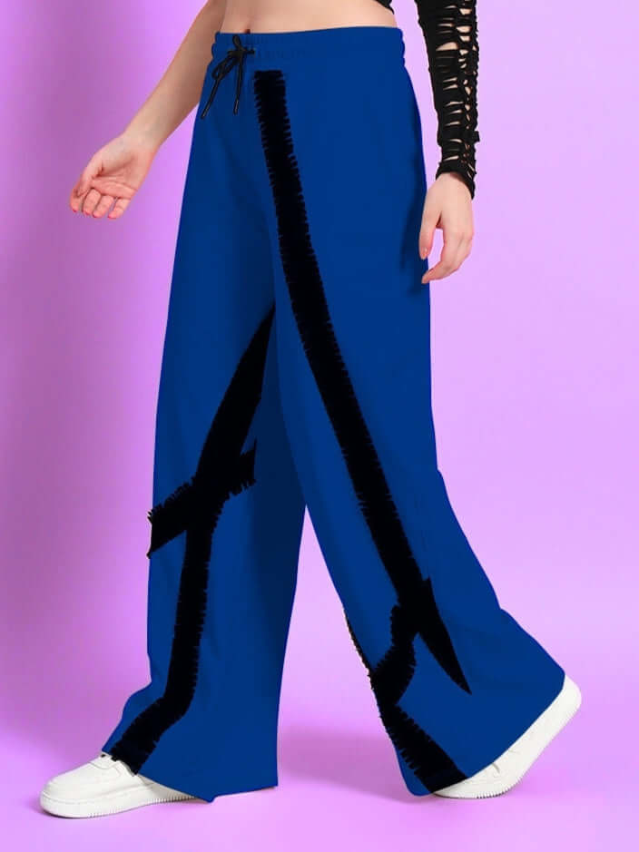 Woman wearing blue frayed textured stripe joggers, side view, showing unique design. Ideal for custom fit orders from DUDS.