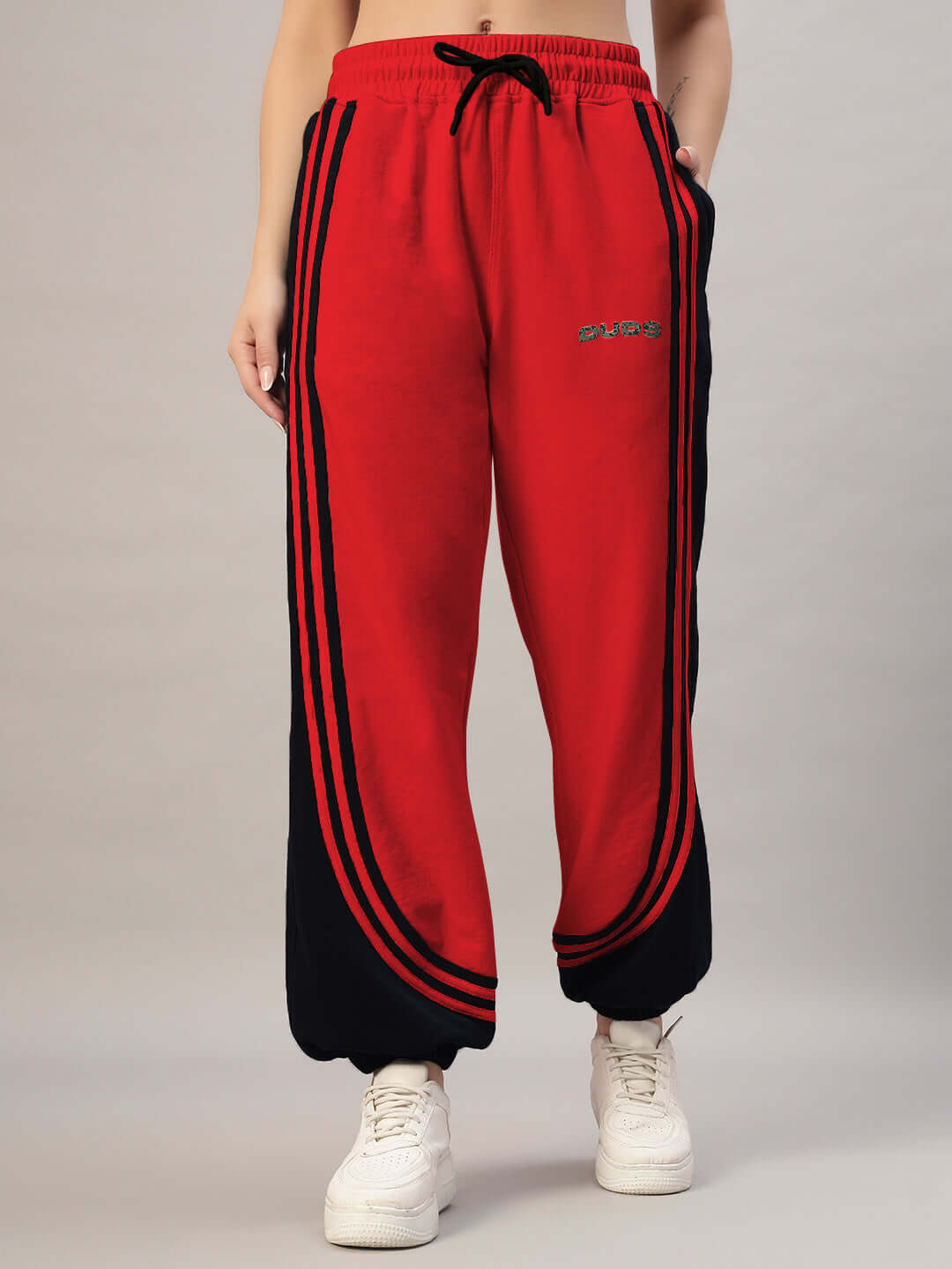 Red and black women’s contrast joggers with customizable sizing. Featuring elastic waistband and sporty design. Ideal for casual wear.