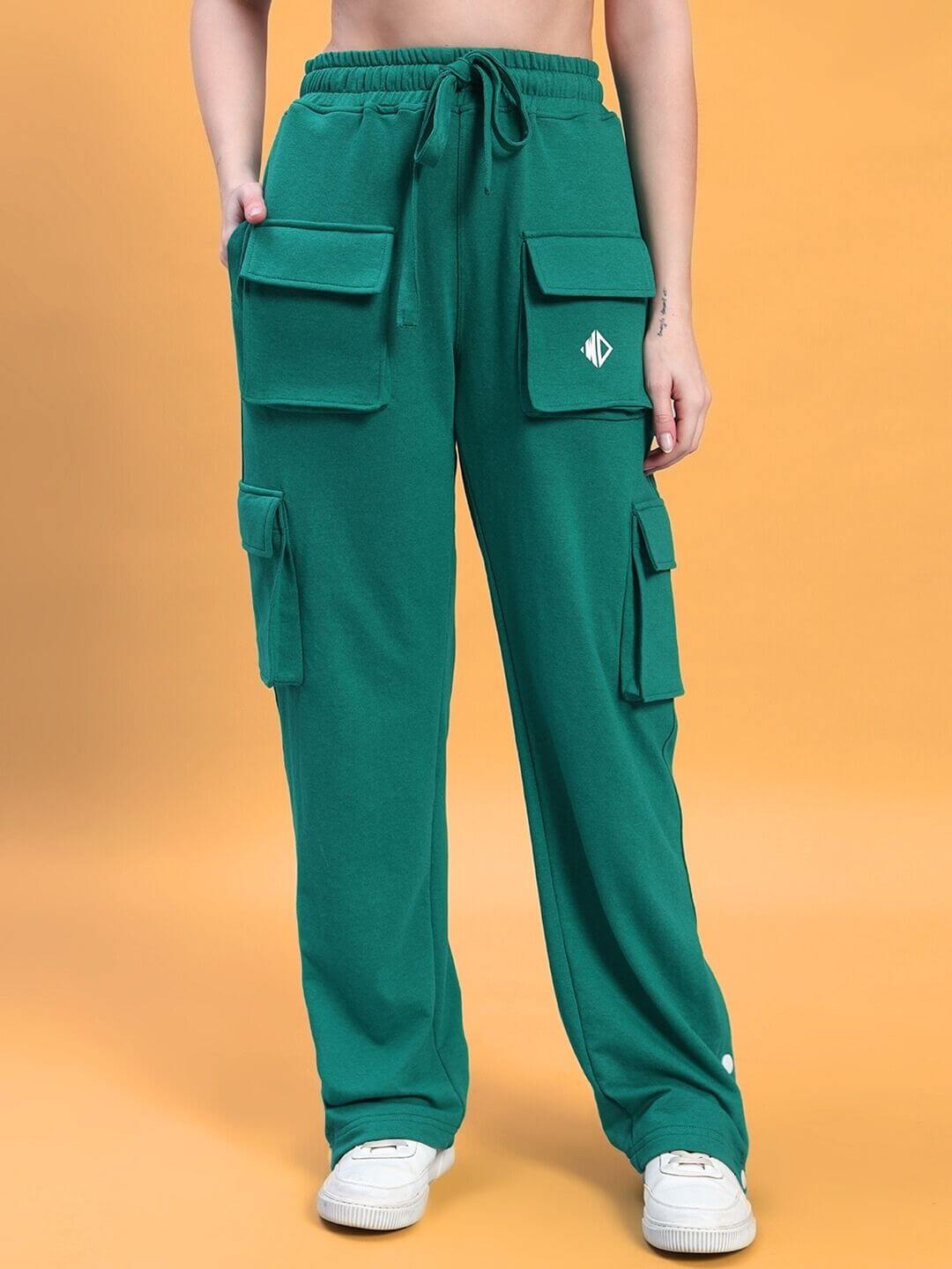Green cargo pants with pocket design on a person, casual and stylish.