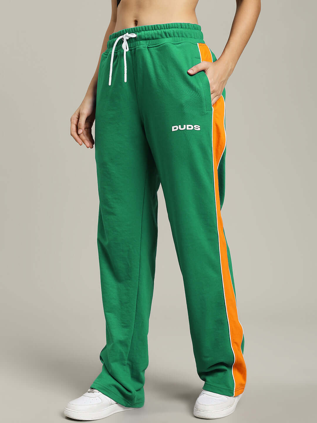 Women's green Sanford stripe joggers by DUDS, featuring orange side stripes, custom fit option available.
