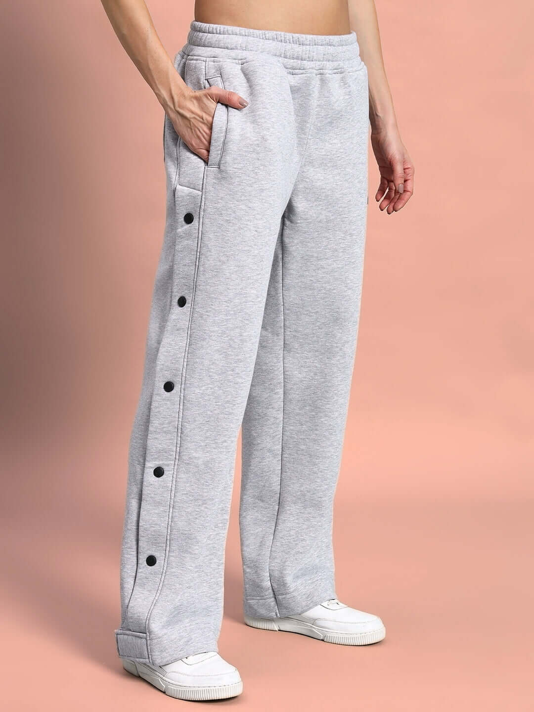 woman wearing grey women's polar fleece jogger with side buttons, customizable fit, made-to-order by DUDS, ships in 7-10 days