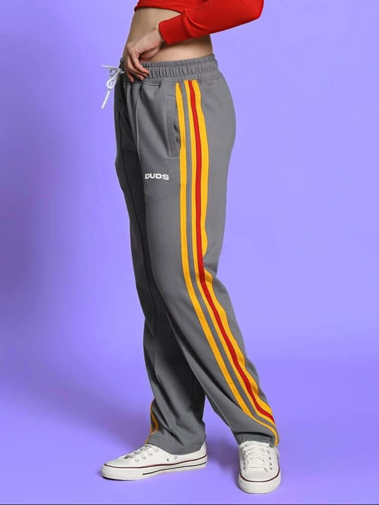 Women's grey jogger pants with yellow and red stripes, by DUDS, made to order with custom fit option.