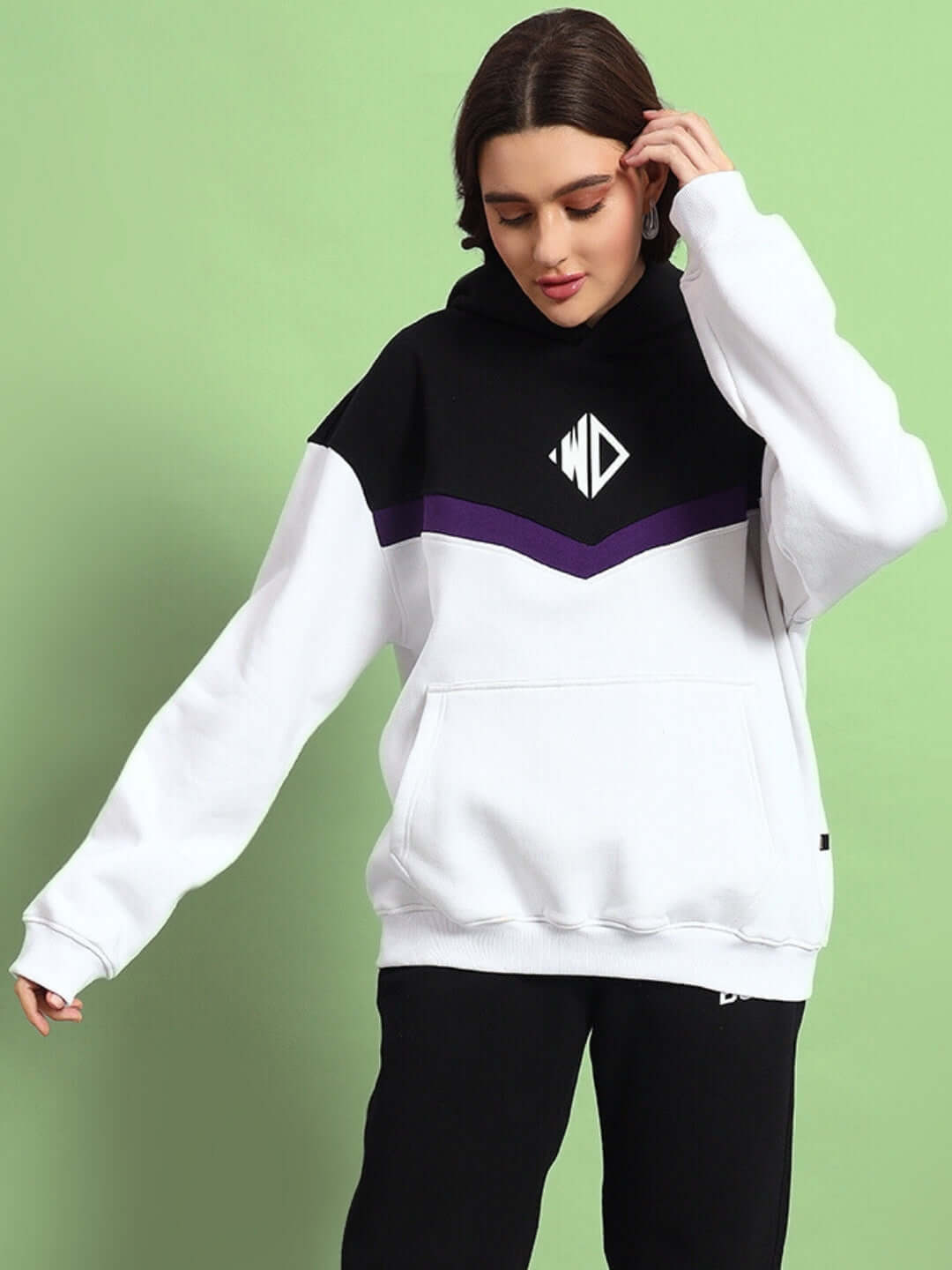 Model wearing WOMEN HARLEY FLEECE COLORBLOCK CO-ORD WHITE PURPLE with sporty design, showcasing comfort and style in coordinated look.