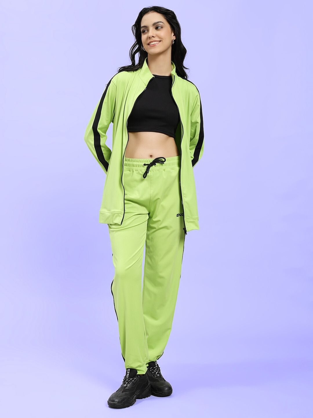 Model wearing WOMEN HIGH PERFORMANCE CO-ORD SET NEON GREEN, sporty and stylish outfit for trendsetters, with energy-boosting design.